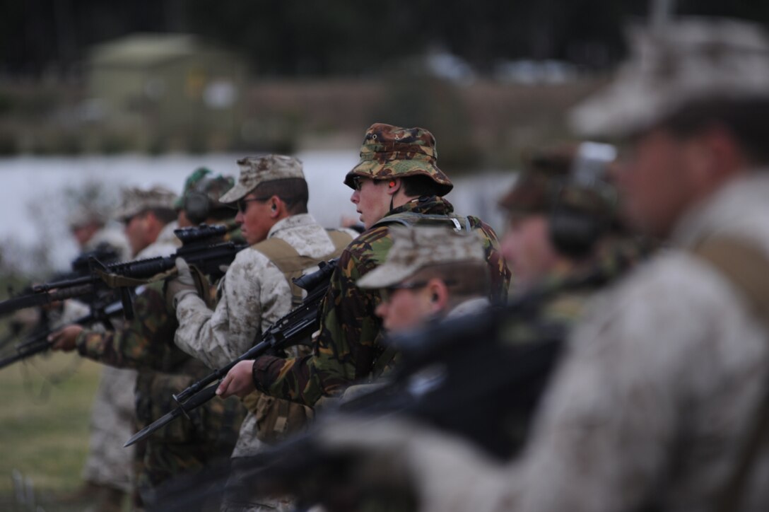 Marines from Virginia, Hawaii and Okinawa, Japan line up side-by-side with Australian and New Zealand counterparts before firing on targets during the bayonet portion of the 2011 Australian Army Skill at Arms Meeting (AASAM) May 15. The week-long meeting pit military representatives from partner nations in competition in a series of grueling combat marksmanship events. Represented nations include Canada, France (French Forces New Caledonia), Indonesia, Timor Leste, Brunei, Netherlands, U.S., Papua New Guinea, New Zealand, Singapore, Malaysia, Thailand as well as a contingent of Japanese observers. (U.S. Air Force photo by Master Sgt. Cohen A. Young)